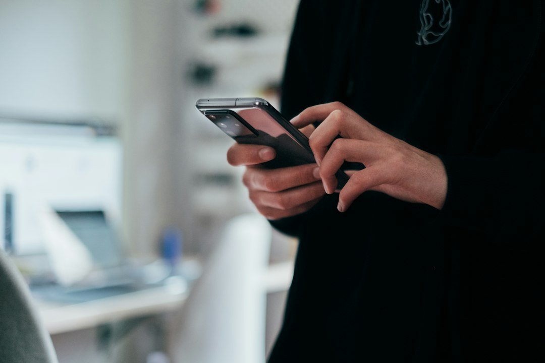 Person holding a smartphone, representing a new AI texting assistant app
