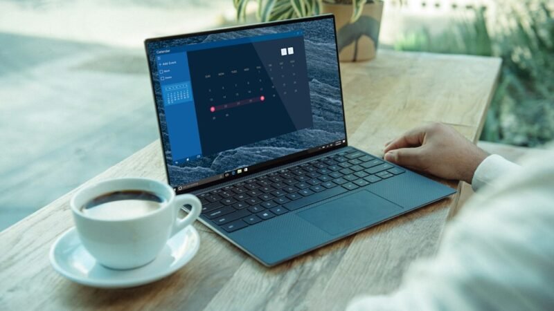 Laptop screen representing an AI browser agent taking actions across open tabs