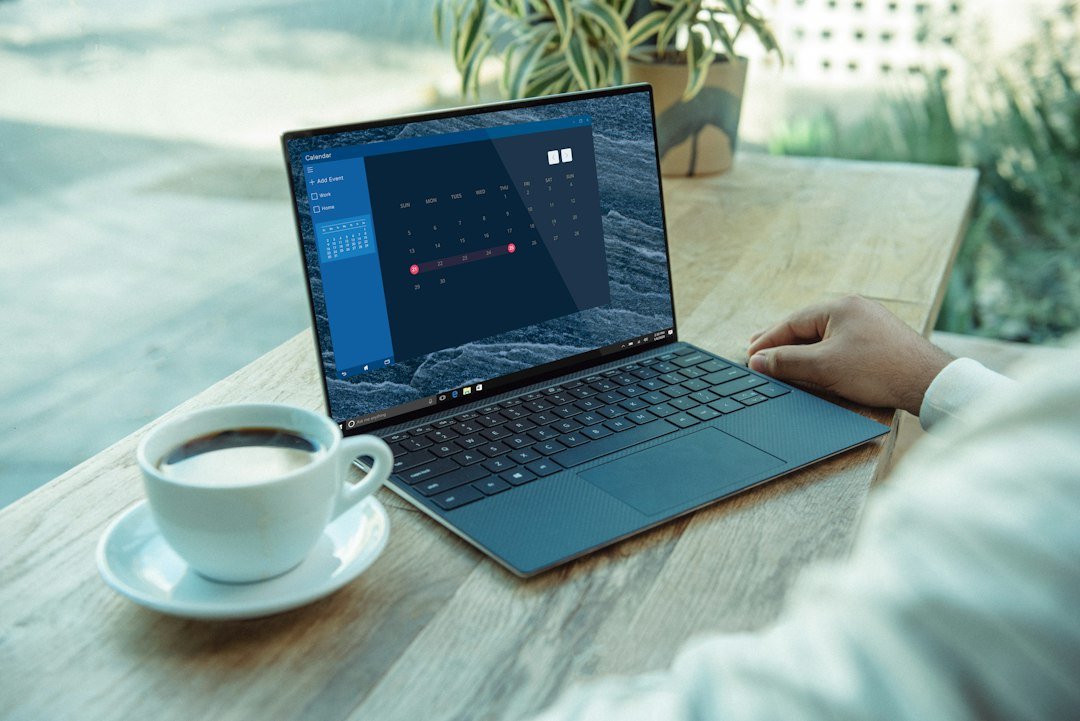 Laptop screen representing an AI browser agent taking actions across open tabs