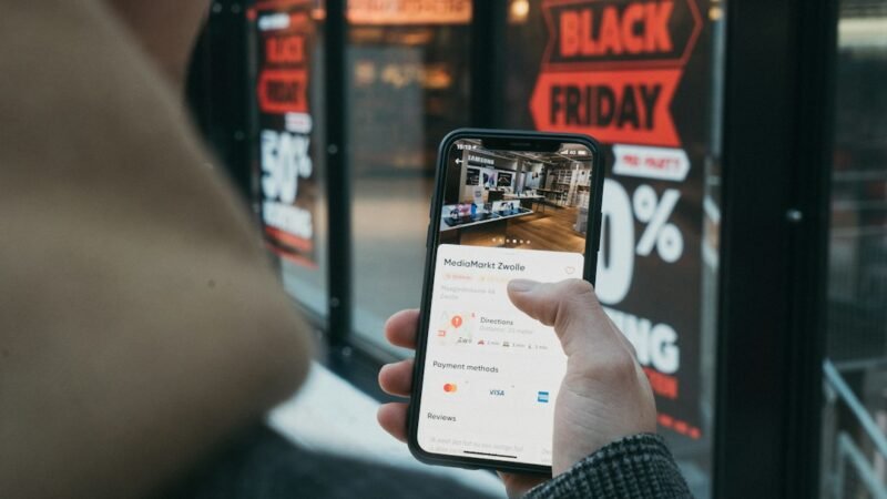Person shopping online with cards and a laptop, illustrating ChatGPT's new Shopping Research feature