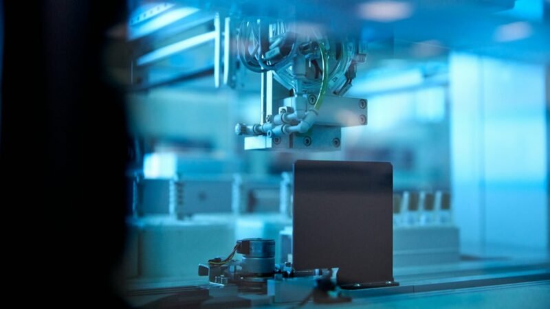 Laboratory researcher processing samples, representing robotics AI research