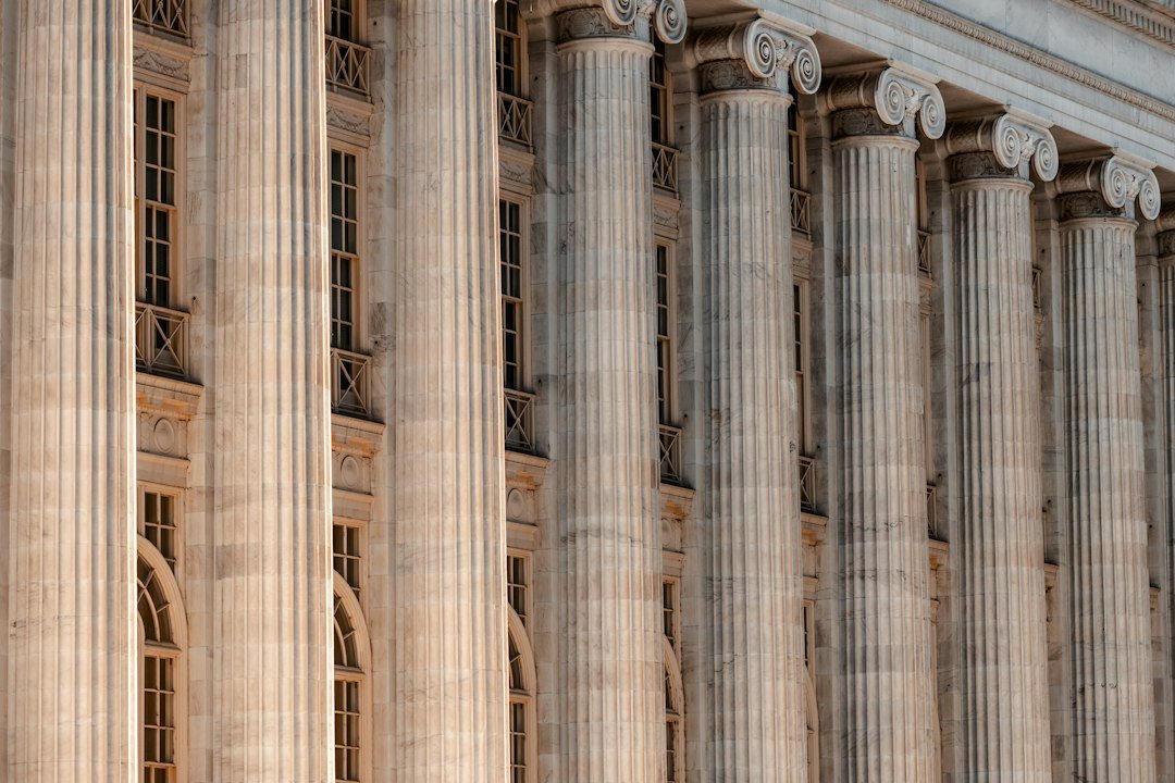 Government building facade with columns and a clock