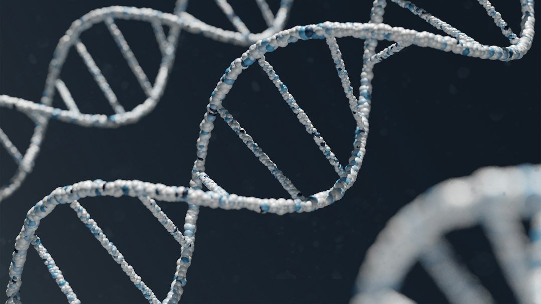 Glowing blue and white DNA double helix structure against a dark background
