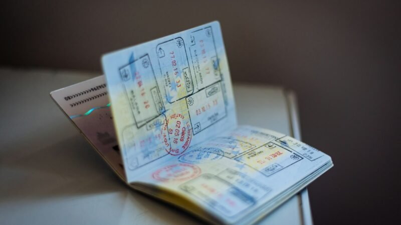 A well-worn passport covered in visa and entry stamps
