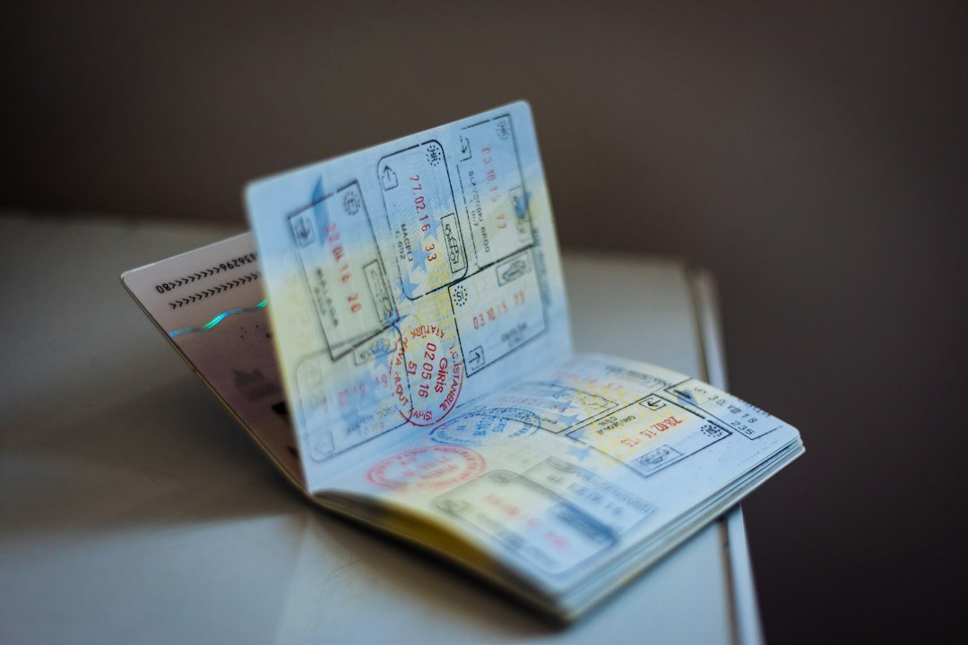 A well-worn passport covered in visa and entry stamps