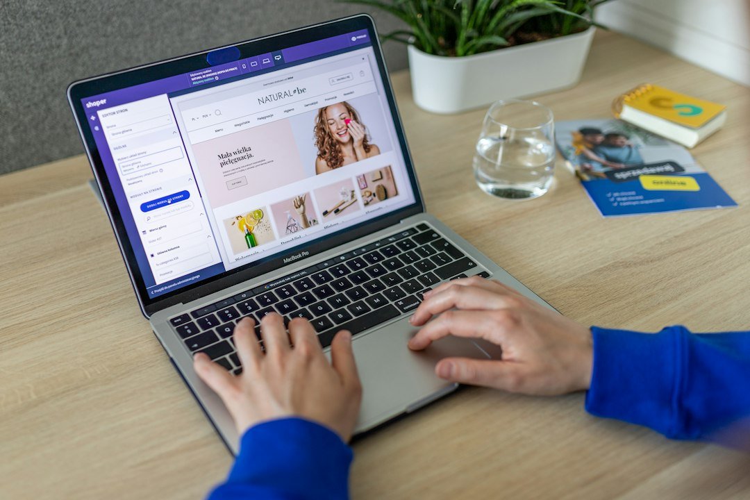 Hands typing on a keyboard while changing an online store design