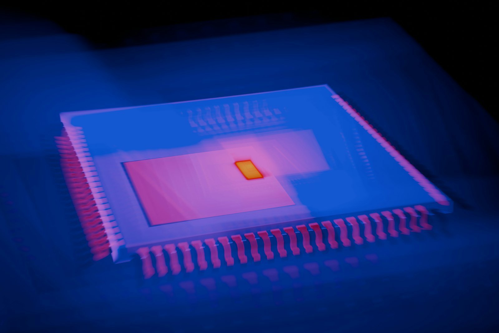 Close-up of a computer chip in a dark laboratory setting