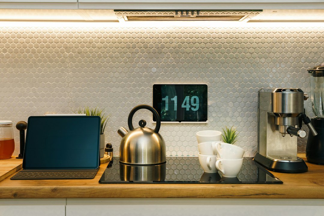 Modern kitchen counter with a digital clock display and coffee maker