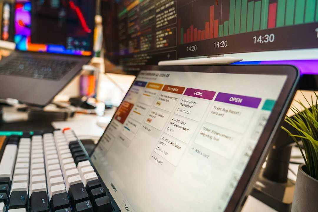 Close up of a software developer workspace with a mechanical keyboard and task board