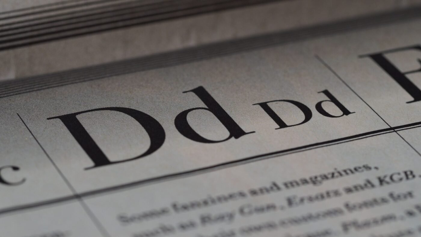 Close-up of newspaper typography and lettering