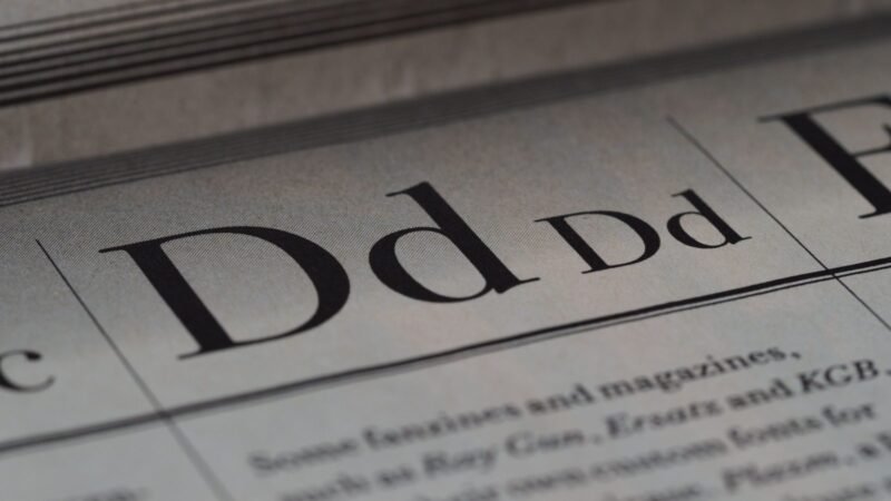 Close-up of newspaper typography and lettering