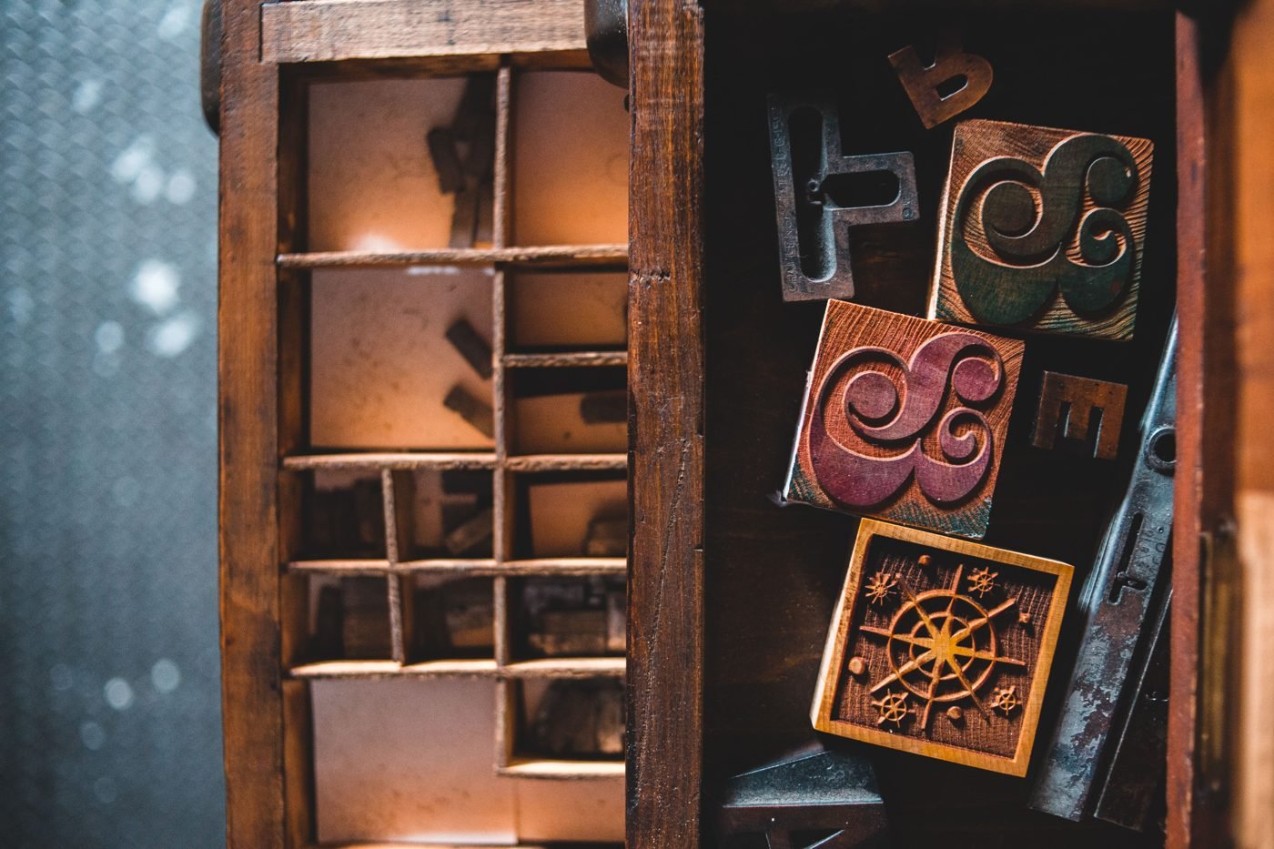 Vintage wooden letterpress type blocks in a workshop