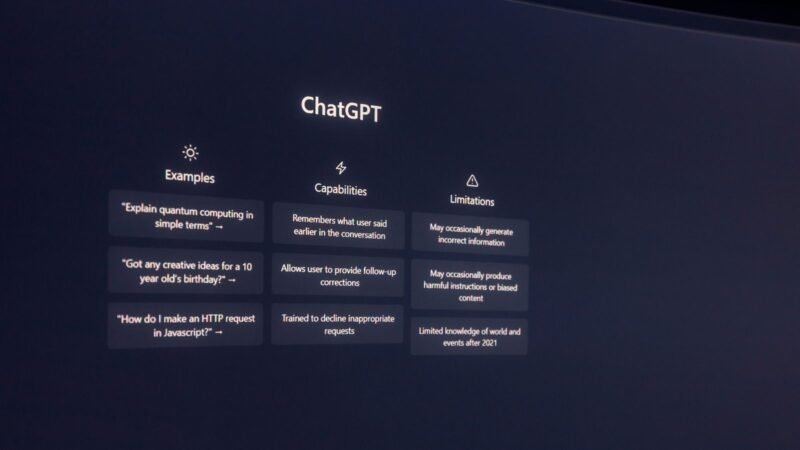 Laptop screen showing the ChatGPT start page with examples and capabilities