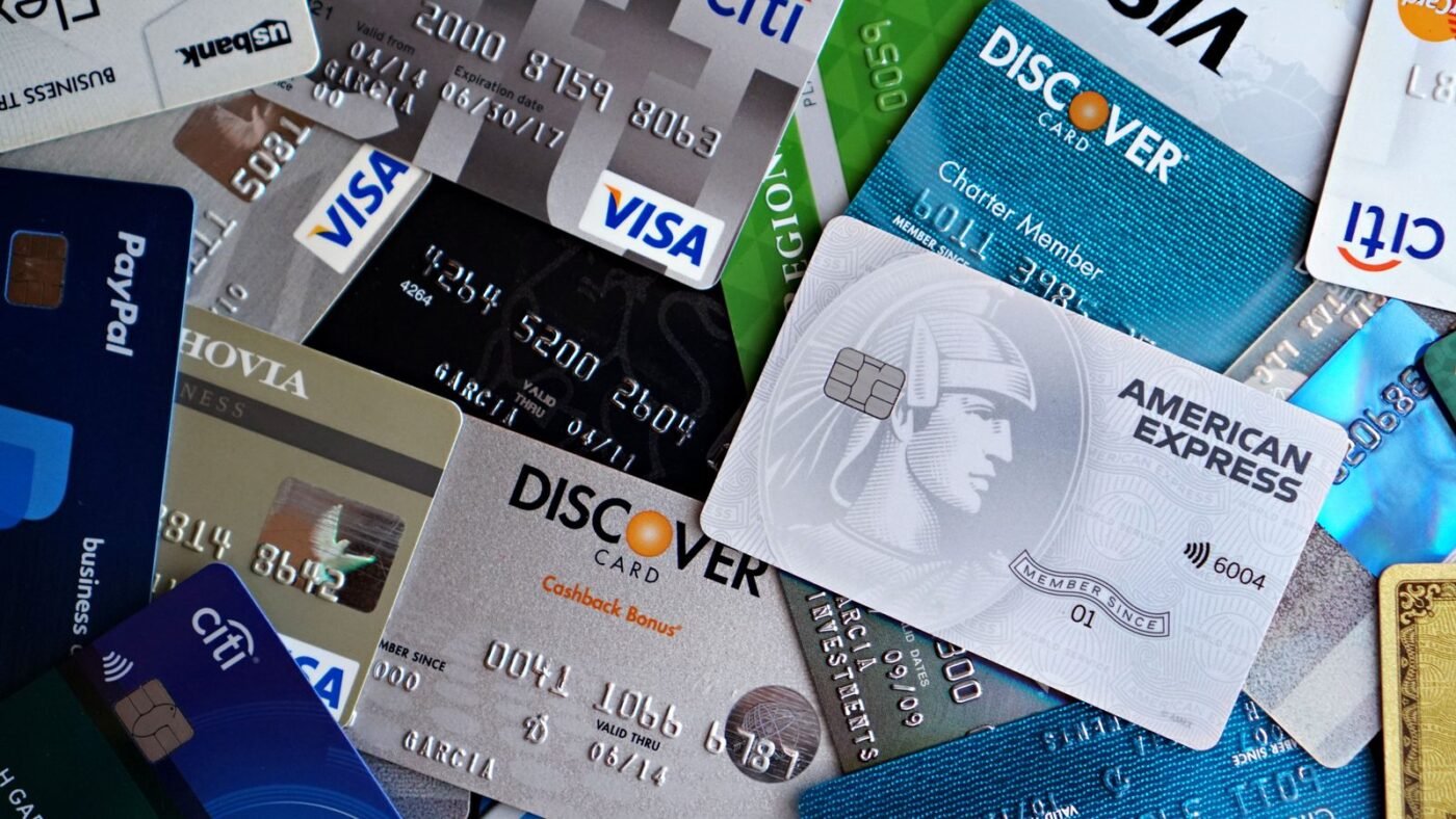 Flat lay of assorted credit and debit cards from various banks