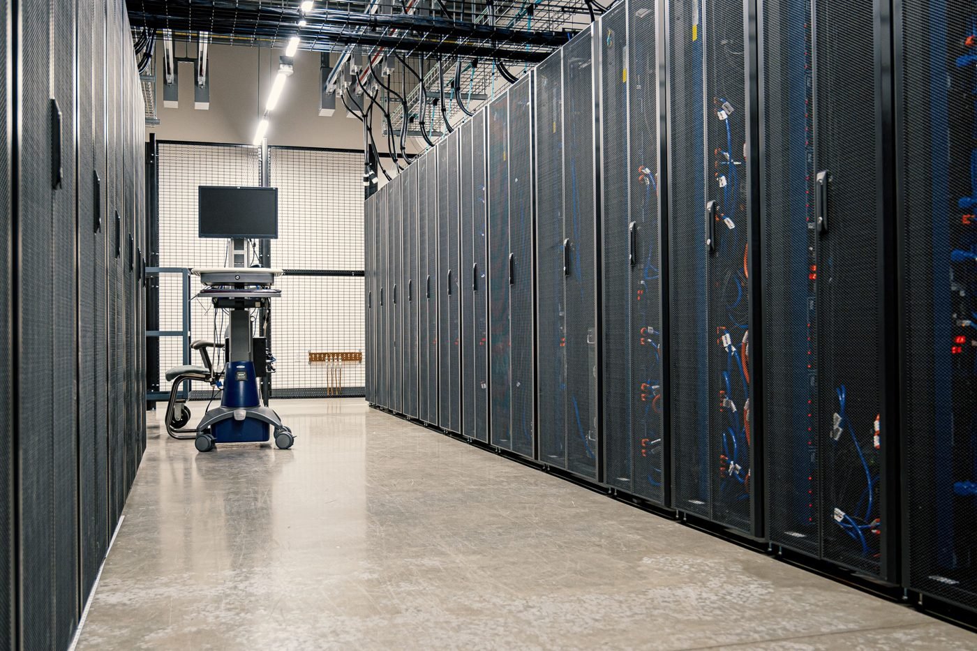 Corridor of server racks in a modern data center